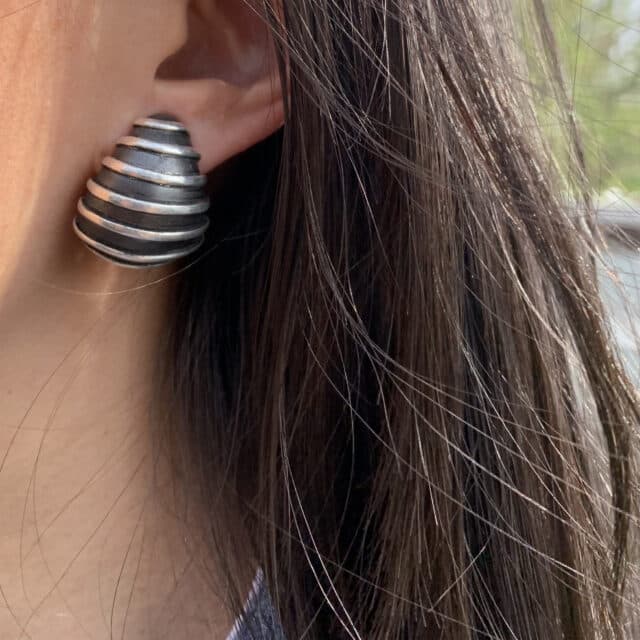 Sharp Drop w/ Horizontal Silver Stripes